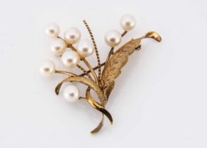 A 14k marked yellow metal and cultred pearl spray brooch,