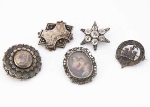 Five silver and white metal brooches,