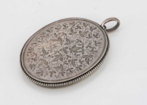 An Edwardian continental white metal locket,