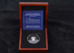 A modern platinum proof penny coin,