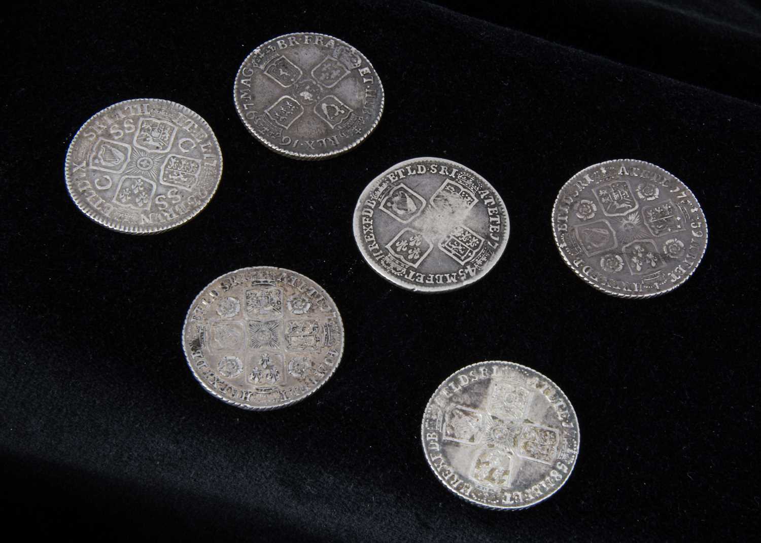 A collection of six early milled British shillings,