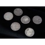 A collection of six early milled British shillings,