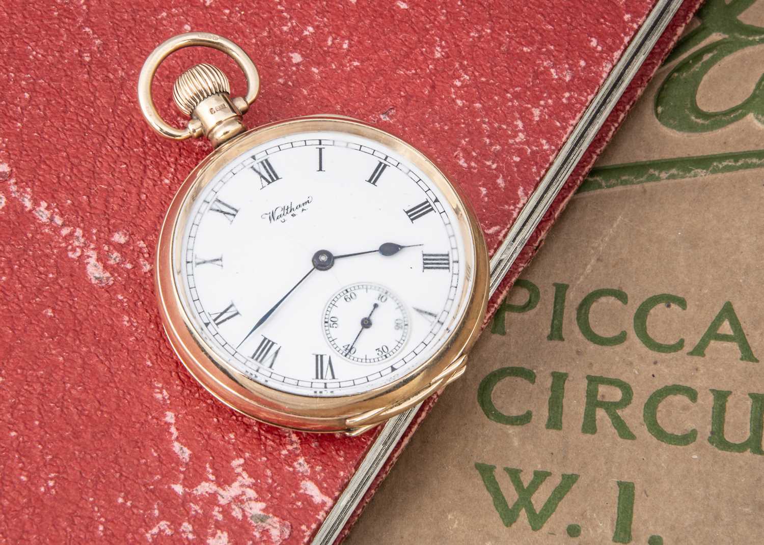 A c1920s 9ct gold open faced pocket watch by Waltham,