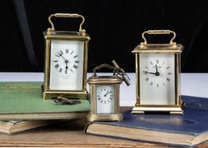 Three brass carriage clock timepieces,