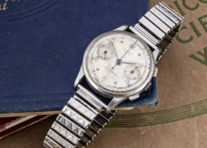 A circa 1950 Universal Uni-dash Compact manual wind stainless steel wristwatch,