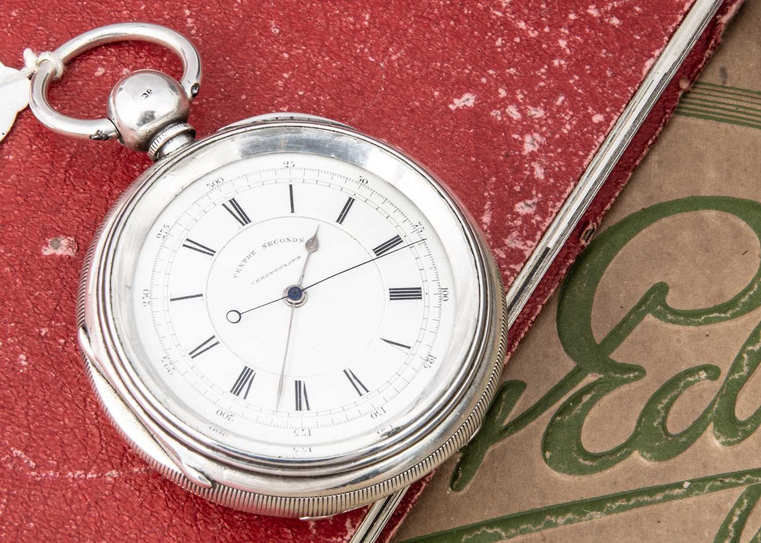 An oversized Victorian silver open faced pocket watch,