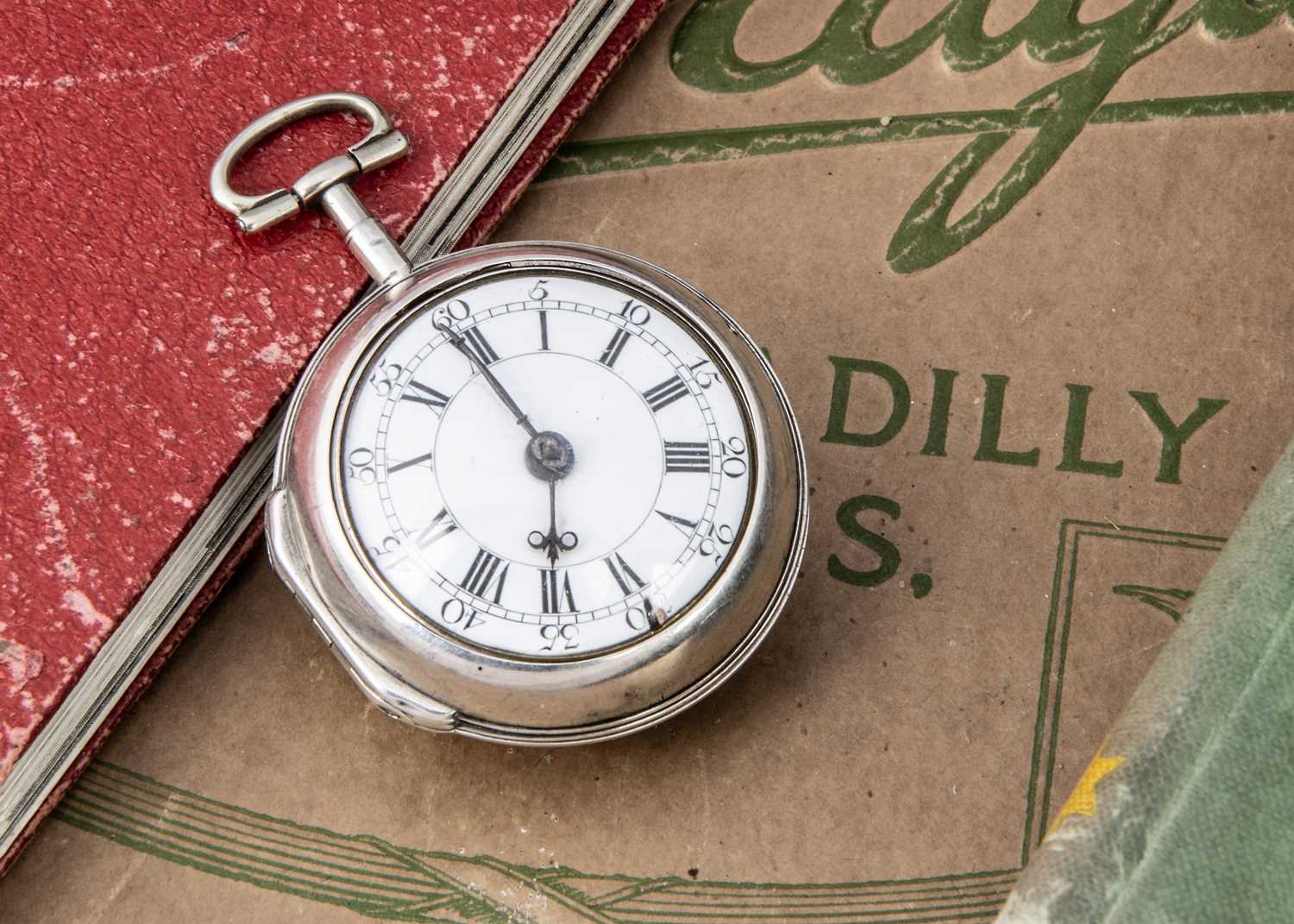 A George III silver silver pair cased pocket watch by Charles Huntley of London,