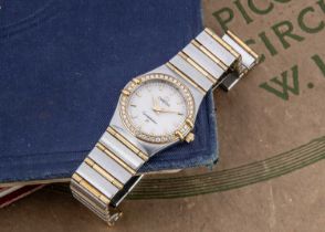A modern Omega Constellation quarts stainless steel and gold lady's wristwatch,