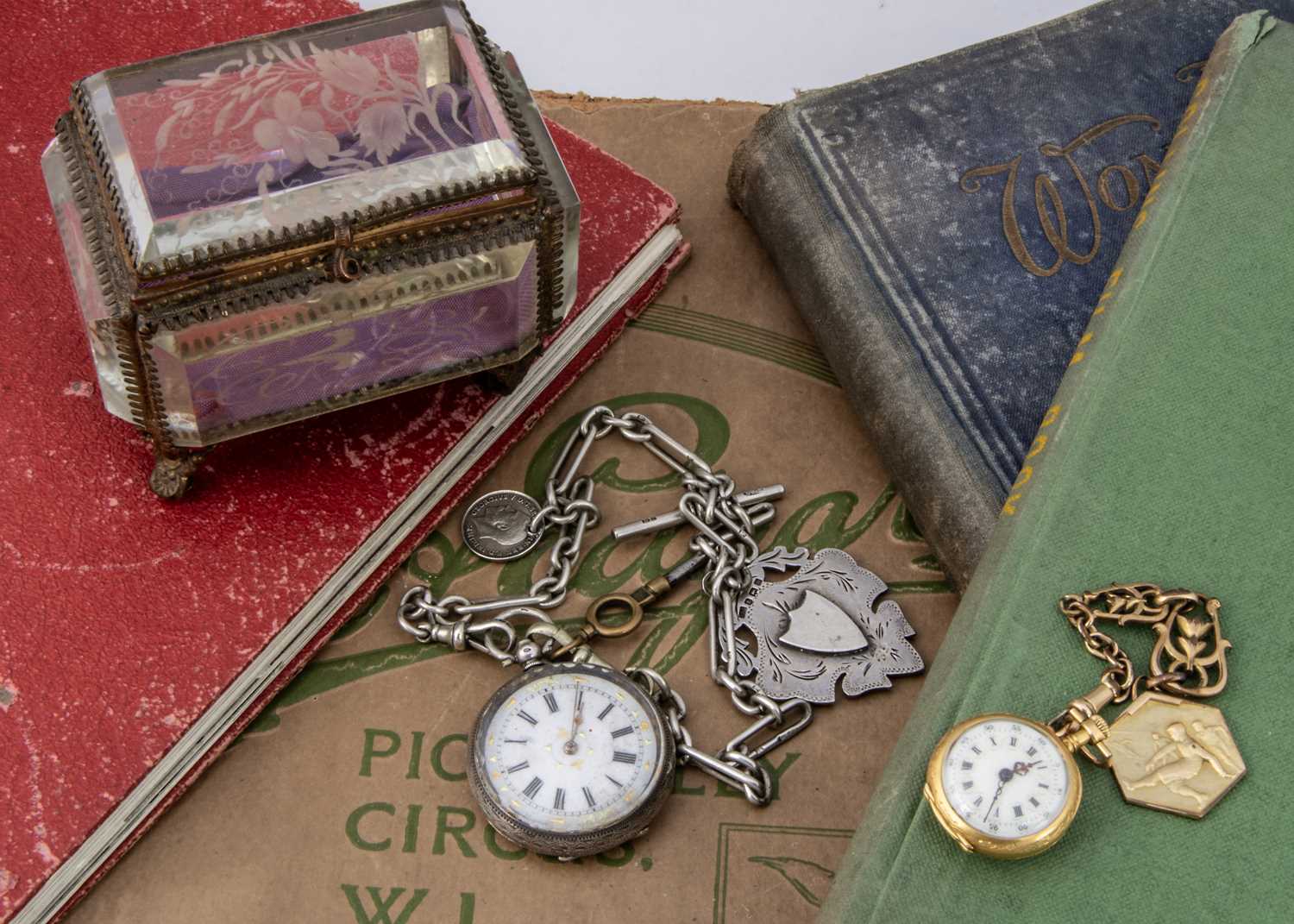 A small French silver gilt fob watch and a silver pocket watch on chain,