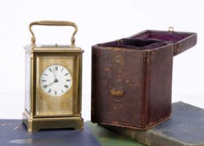 A late Victorian brass carriage repeater timepiece,