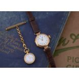 A vintage 9ct gold cased lady's wristwatch and a gold plated nurse's watch on a 9ct gold support,