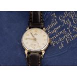 A 1950s Smiths De Luxe manual wind 9ct gold cased wristwatch,