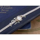 A circa 1960's white 9ct gold and diamond set lady's cocktail dress watch by Rotary,