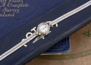 A circa 1960's white 9ct gold and diamond set lady's cocktail dress watch by Rotary,