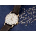 A 1950s Smiths De Luxe manual wind 9ct gold cased wristwatch,