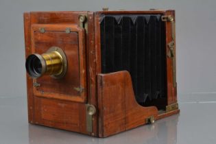 A Mahogany and Brass Half Plate Tailboard Camera,