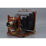 A Mahogany and Brass Half Plate Camera