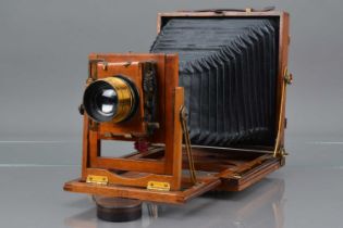 A Mahogany and Brass Half Plate Camera,