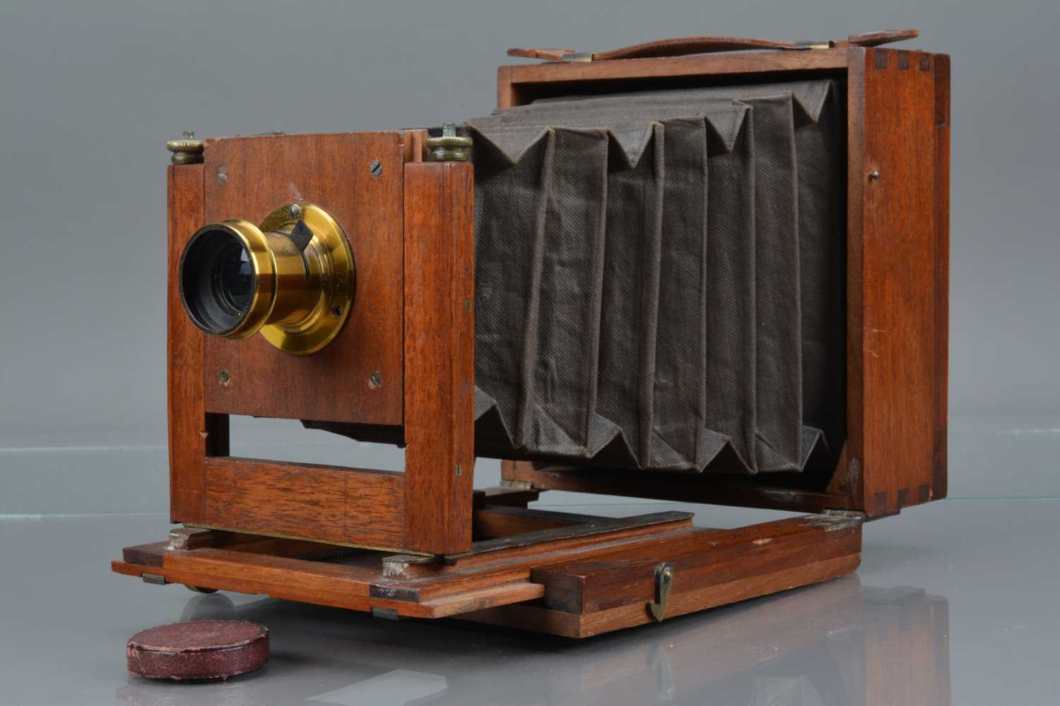 A Mahogany and Brass Quarter Plate Camera,