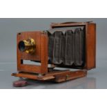 A Mahogany and Brass Quarter Plate Camera,