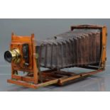 A Thornton Pickard Imperial Triple Extension Mahogany and Brass Half Plate Camera,