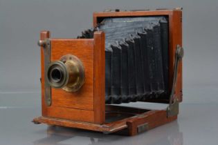 A Mahogany and Brass Quarter Plate Camera,