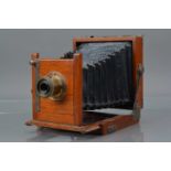 A Mahogany and Brass Quarter Plate Camera,