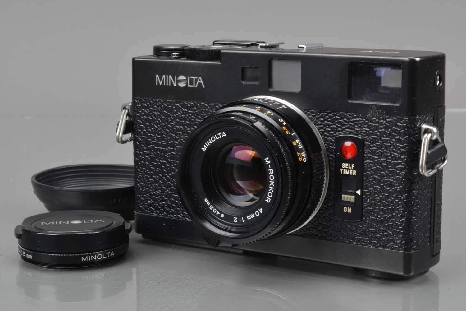 A Minolta CLE Rangefinder Camera,