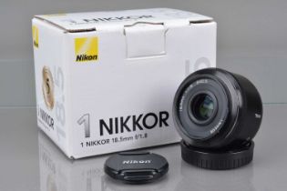 A Nikon 1 Nikkor 18.5mm f/1.8 Lens,