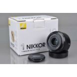 A Nikon 1 Nikkor 18.5mm f/1.8 Lens,