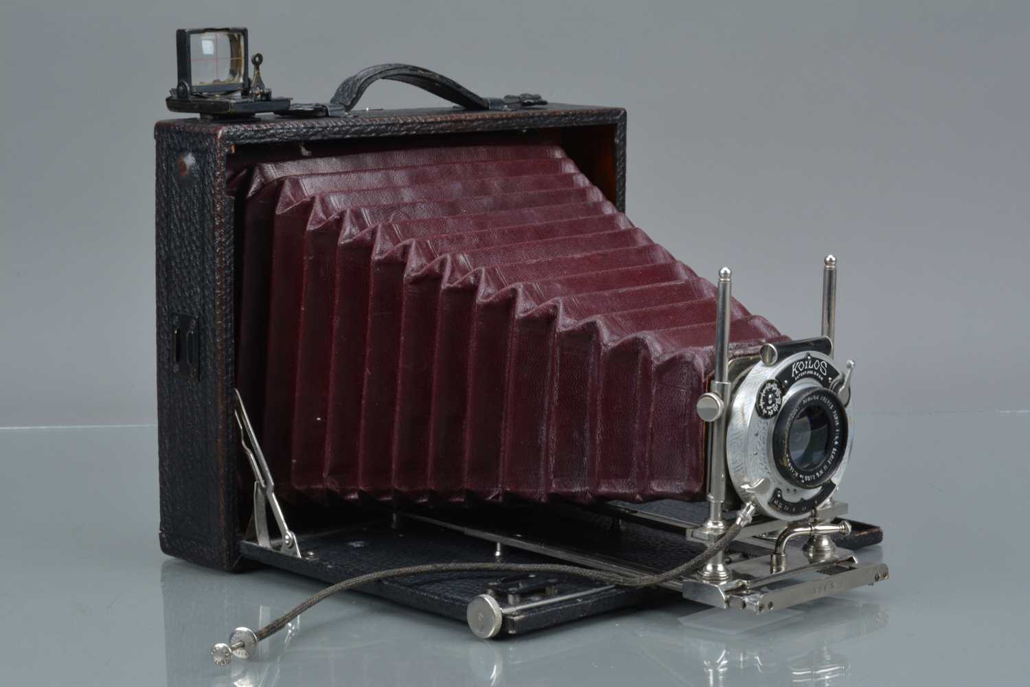 A Koilos 6¾''x5'' Folding Bed Camera,