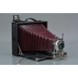 A Koilos 6¾''x5'' Folding Bed Camera,