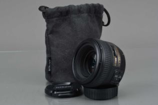 A Nikon AF-S Nikkor 50mm f/1.4G Lens,