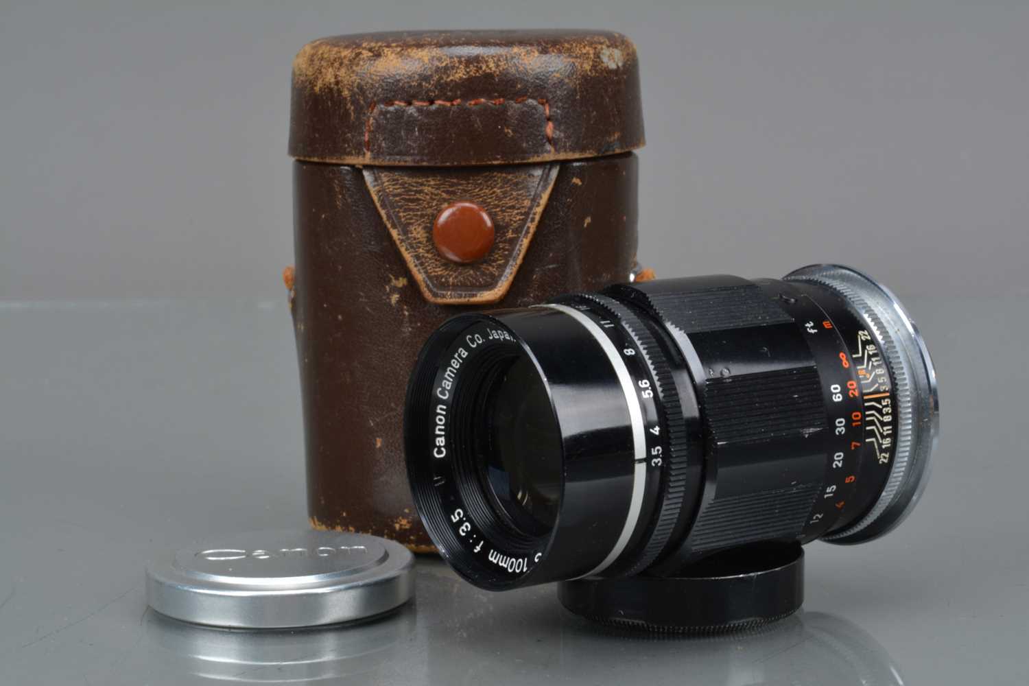 A Canon 100mm f/3.5 Lens,