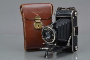 A Voigtländer Inos II Folding Camera,