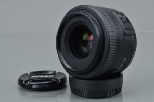 A Nikon AF-S DX Nikkor 35mm f/1.8G Lens,
