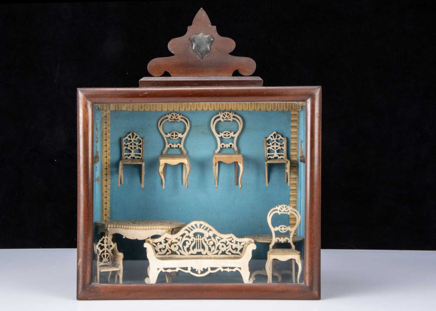 A doll house with interior and dolls ca 1910