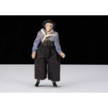 An unusual late 19th century all-bisque sailor doll,