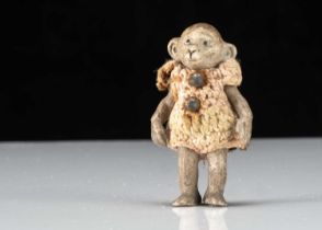 A Hertwig all-bisque dolls’ house monkey boy doll,