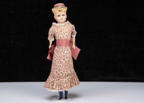 A German 19th century wax over composition shoulder head dolls with moulded hat,