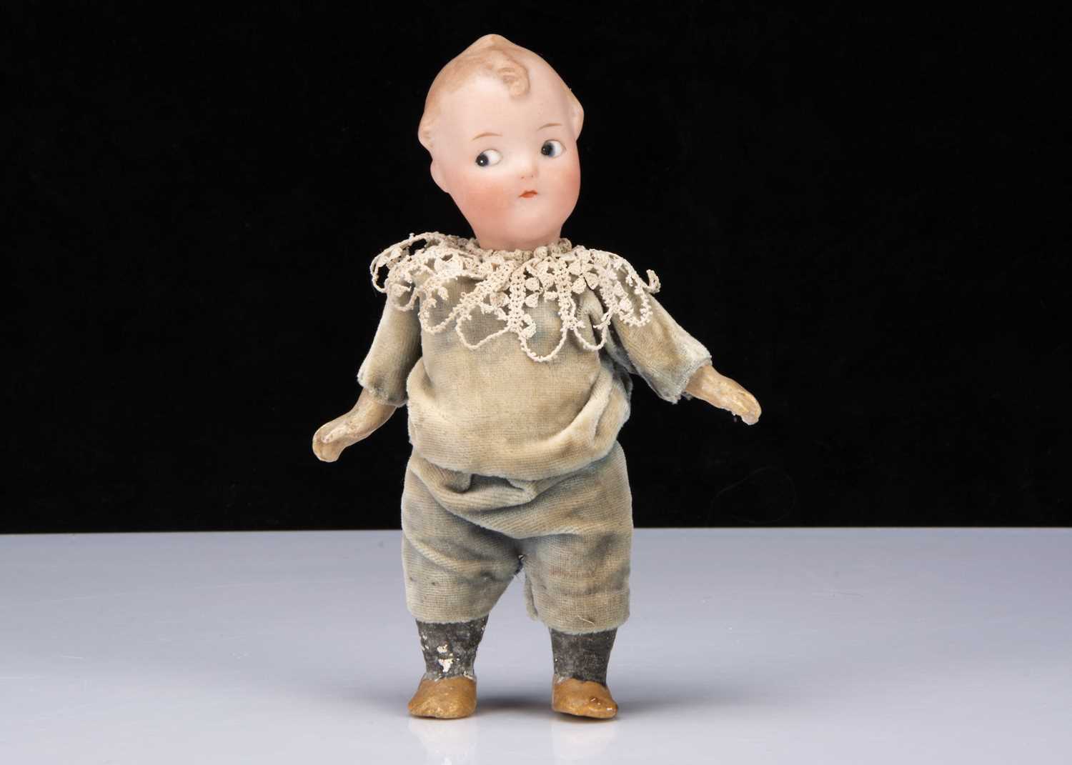 A small Gebruder Heubach 9085 googly eyed doll,