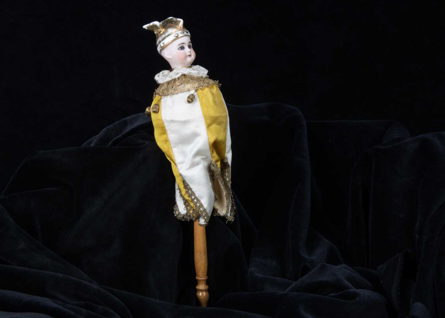 An unusual musical marotte with rare moulded winged hat,