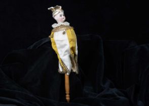 An unusual musical marotte with rare moulded winged hat,