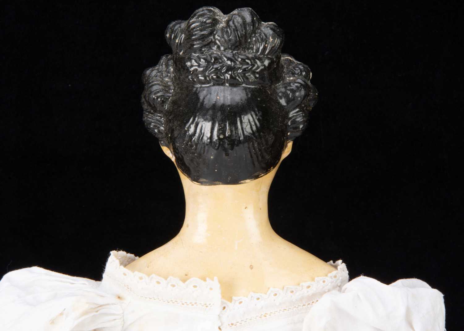 A mid 19th century German papier-mâché shoulder head doll with Apollo Knot hair, - Image 2 of 3