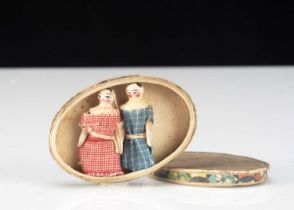 Two miniature Grodnerthal dolls’ house dolls in an oval cardboard box