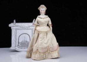 A rare Kling bisque shoulder head lady doll with elaborate hair and decorated shoulders,