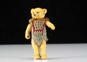 A Hertwig all-bisque dolls’ house teddy bear boy doll,