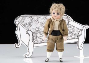 A Kestner 131 all-bisque swivel head dolls’ house boy doll,