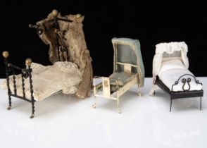 Three dolls’ house beds,