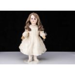 A bisque headed child doll impressed 8,